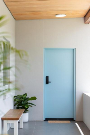 The Elements l Water l 4 Stunning Apartments each with Private Outdoor Dining l Walk to the Beach l Pet Family and Event Friendly l Wifi l Netflix l Outdoor Shower l Communal BBQ Pavilion and Lawn Are